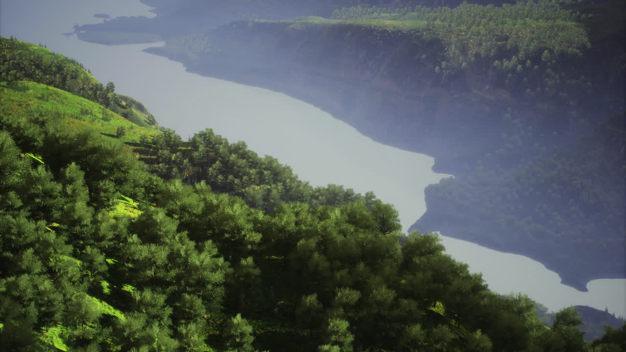 Breathtaking view of a serene river flowing through lush green hills