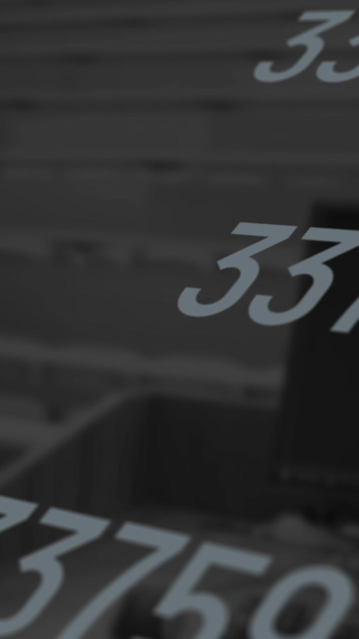Animation of multiple numbers changing over computer and empty university room