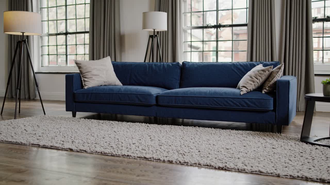 A modern living room with a blue sofa, shot from a low angle