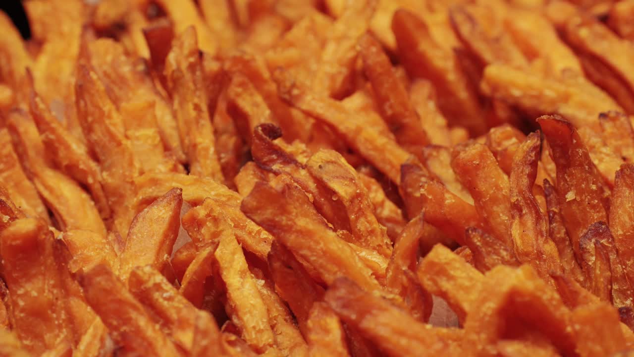 Enjoy golden, perfectly crispy sweet potato fries served neatly in stylish paper cups, ideal for snacks or side dishes