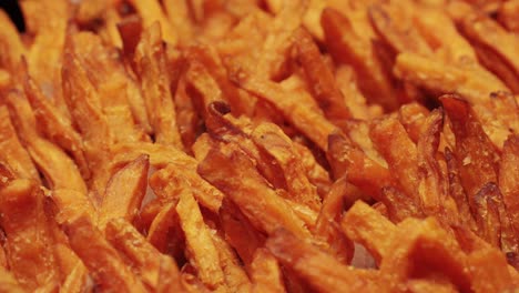 enjoy golden, perfectly crispy sweet potato fries served neatly in stylish paper cups, ideal for snacks or side dishes