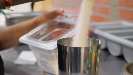 mans hands measure pour sugar into drink shaker, slow motion slider