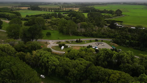 Road-side-campsite-and-majestic-landscape-of-New-Zealand,-aerial-view