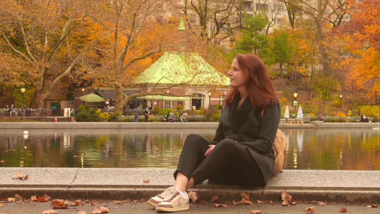 A Woman Seated Near Central Park's Conservatory Water In New York City, USA. Close-up Shot