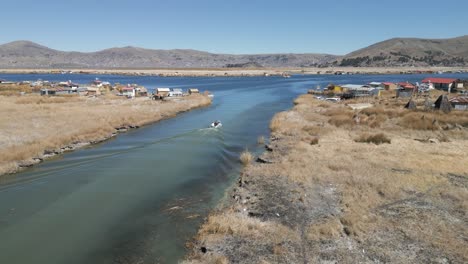 uros floating islands on lake titicaca in peru, south america with boat