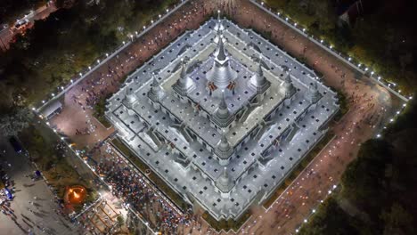 aerial time-lapse view over big pagoda in asokaram temple in samutprakarn near bangkok thailand during asalha puja(asanha bucha)buddhist festival which typically takes place in july, on the full moon.