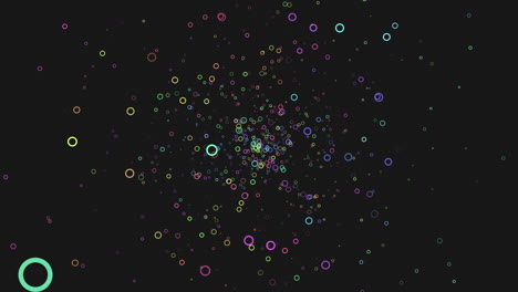 a striking visual composition featuring various colored circles forming a circular pattern against a black backdrop, creating a vibrant and eye-catching display