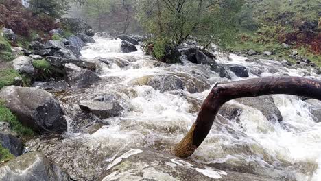 slow motion heavy rain weather riverbank flooding storm raging torrent