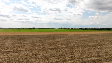 Flying-Over-Agricultural-Fields-In-Marchfeld,-Austria---Drone-Shot