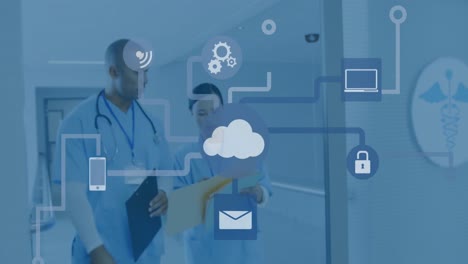 animation of network of connections with icons over diverse doctors at hospital