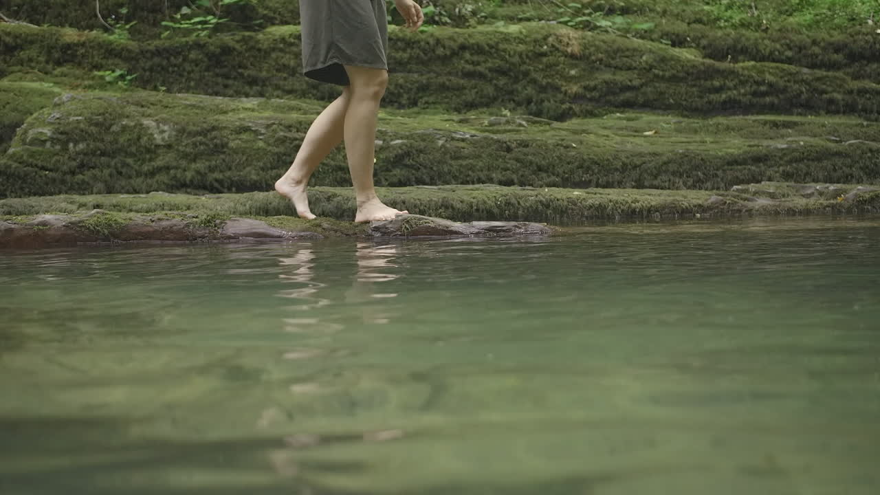 Person walking in a shallow stream