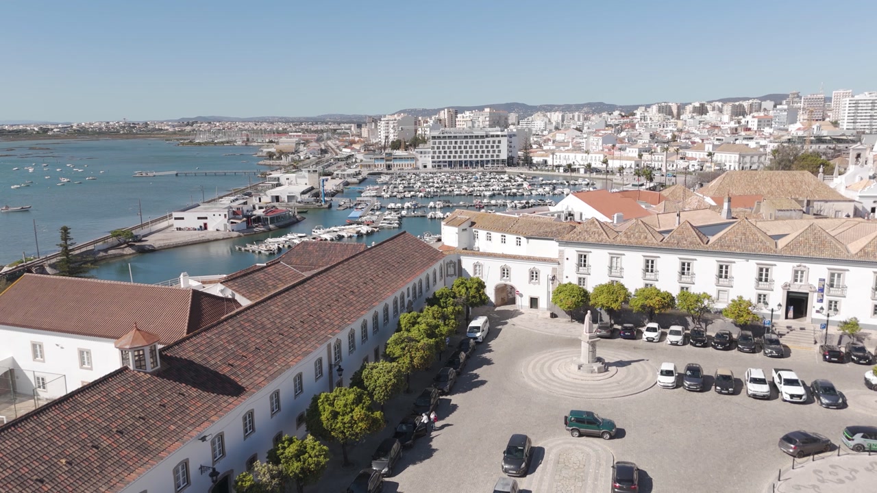 Drone flying over the historic Largo da Sé in Faro, showcasing its streets, architecture, and central square.