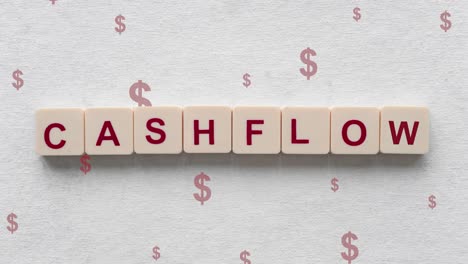 red dollar signs going down behind the cashflow word on scrabble tiles