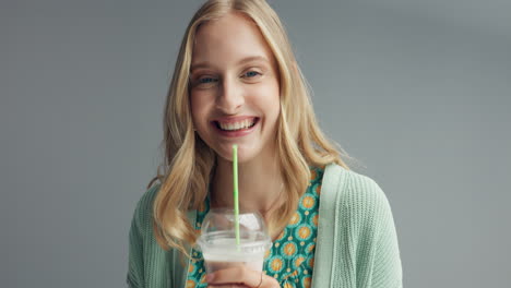 young woman enjoying a smoothie