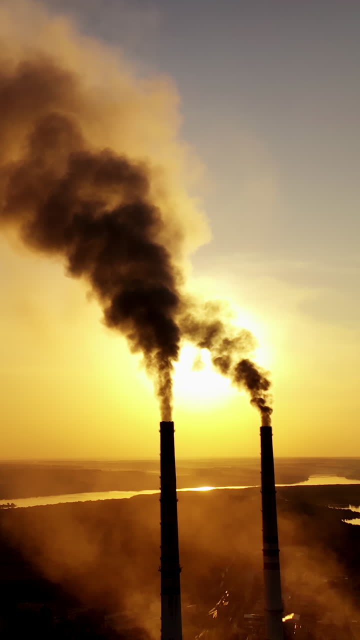 Industrial view with smokestack. Pollution by smoke coming out of factory Vertical video