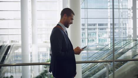 businessman talking on mobile phone in the lobby at office 4k