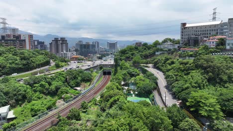 drone cityscape of guandu district in taipei city, taiwan