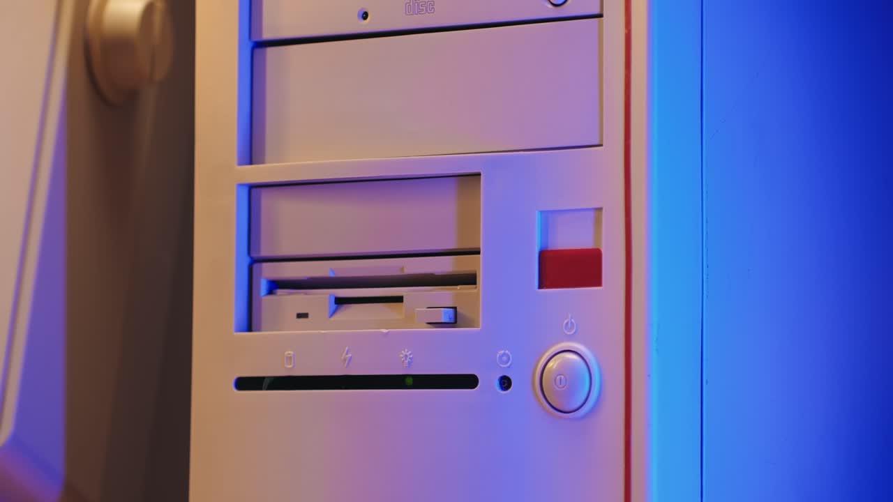 Using diskette for old computer. Music recorder, playing retro computer games. Vintage device for office, obsolete technology. . High quality 4k footage