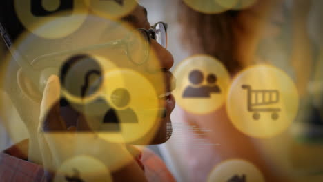 yellow icon with man wearing telephone headset