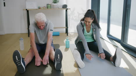 senior and woman stretching together