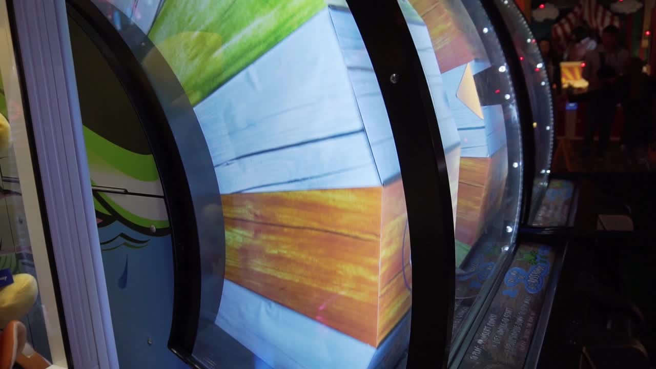 Colourful spinning arcade game at fairground