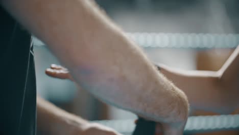 woman boxer getting hands wrapped