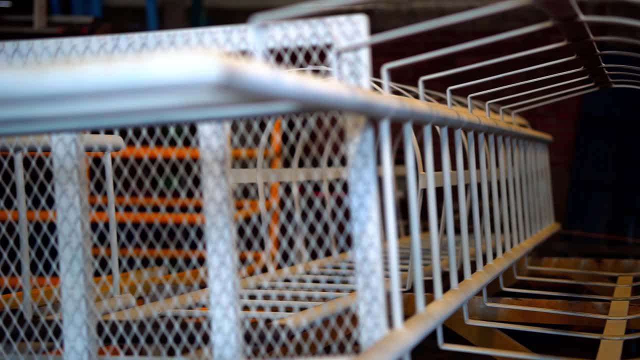 Steel Safety Ladder with a Cage in a Welding Workshop