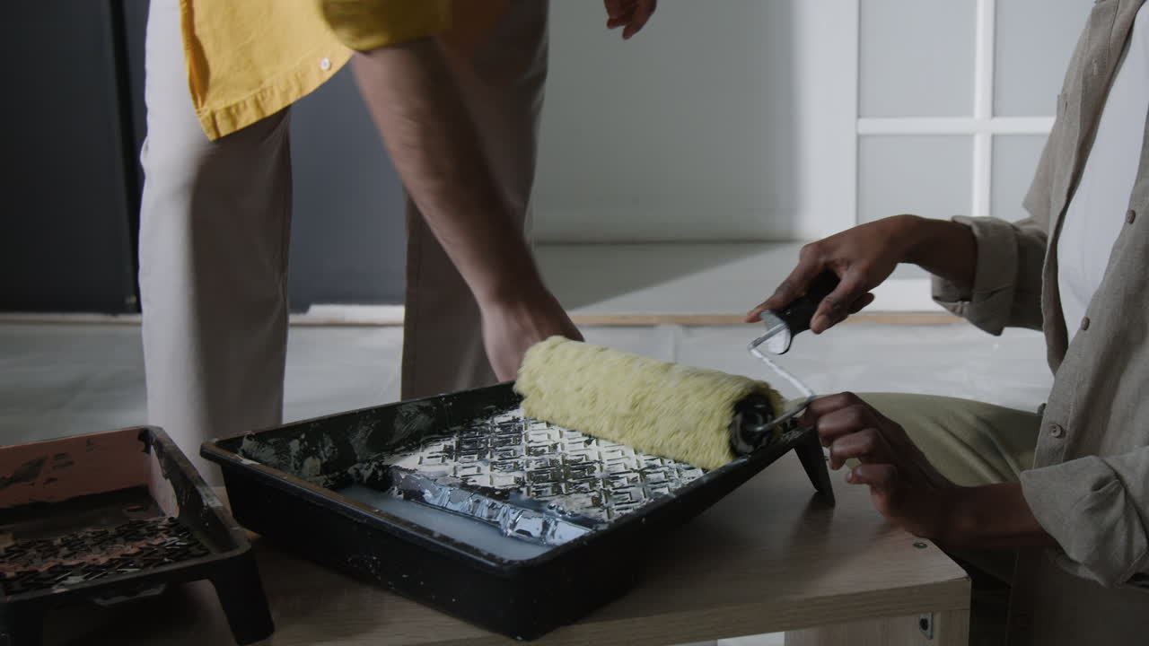 Painting a Room with Roller and Paint