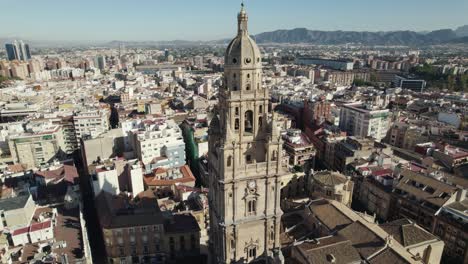 Aerial-view-of-city-and-grand-bell-tower-of-Murcia-Cathedral,-Spain