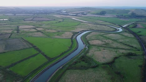 Picturesque-Valley-with-Curving-River-and-Railway-in-East-Sussex,-England