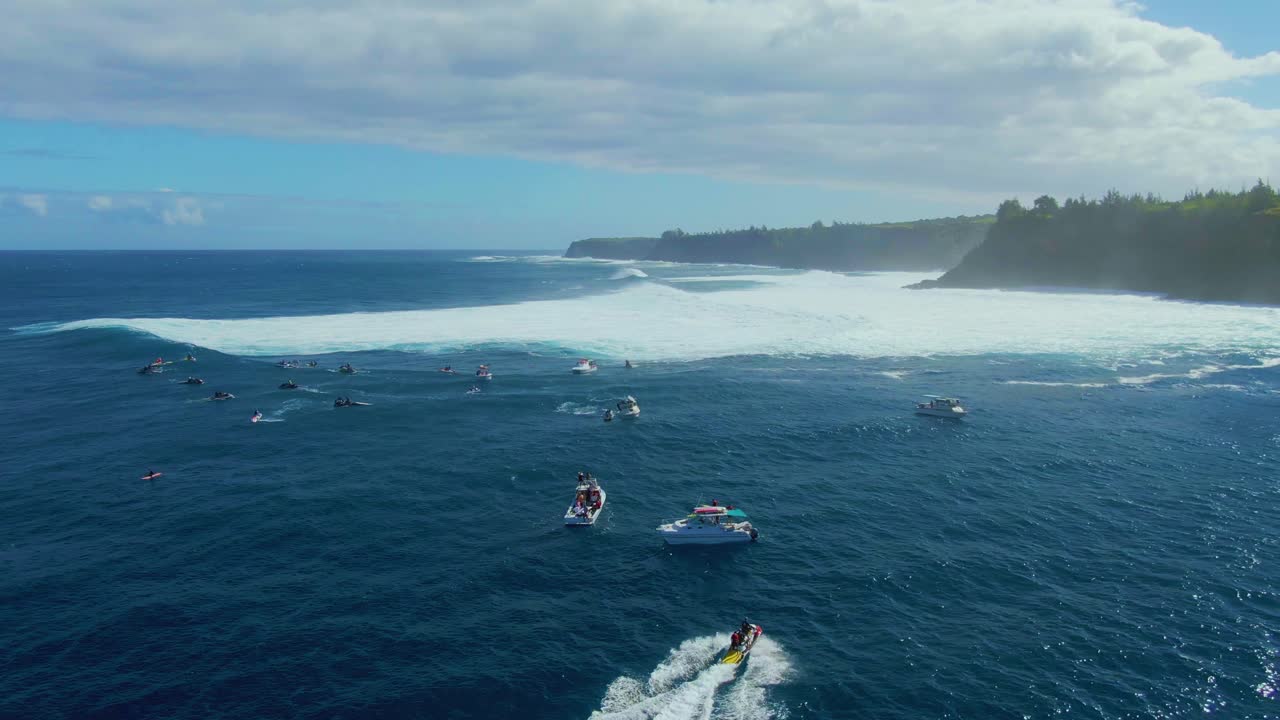 Surf competition on Hawaiian coastline, surfers and life saving beach lifeguard with inflatable rescue boats on dangerous ocean