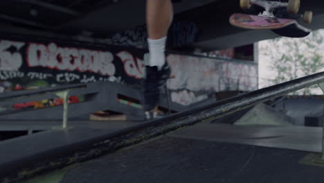 Skateboarder-trying-trick-on-rail-outside.-Teenager-skater-Jumping-on-skate.