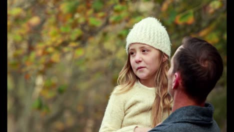 father and daughter in the countryside on autumn day