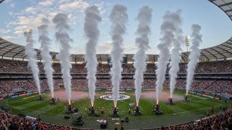 spectacular pyrotechnics ignite the stadium as fans eagerly await the start of an exciting sporting event with a vibrant atmosphere and colorful celebrations
