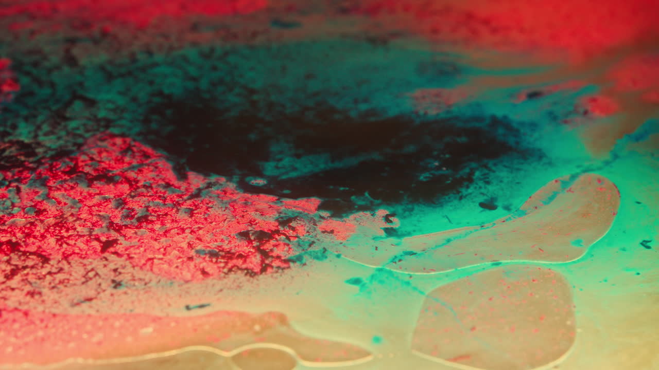 Colourful, organic, liquids macro shots buzzing and flowing