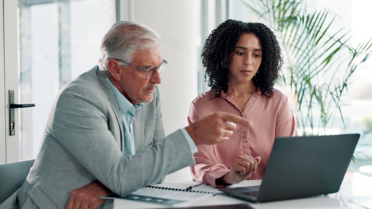 Two colleagues working at a desk