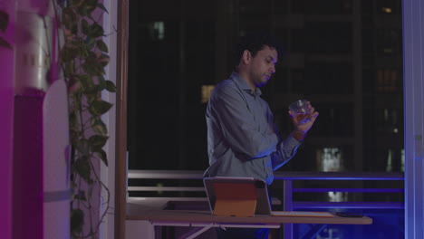 drunk tired young businessman deep in thought while spending late night in office