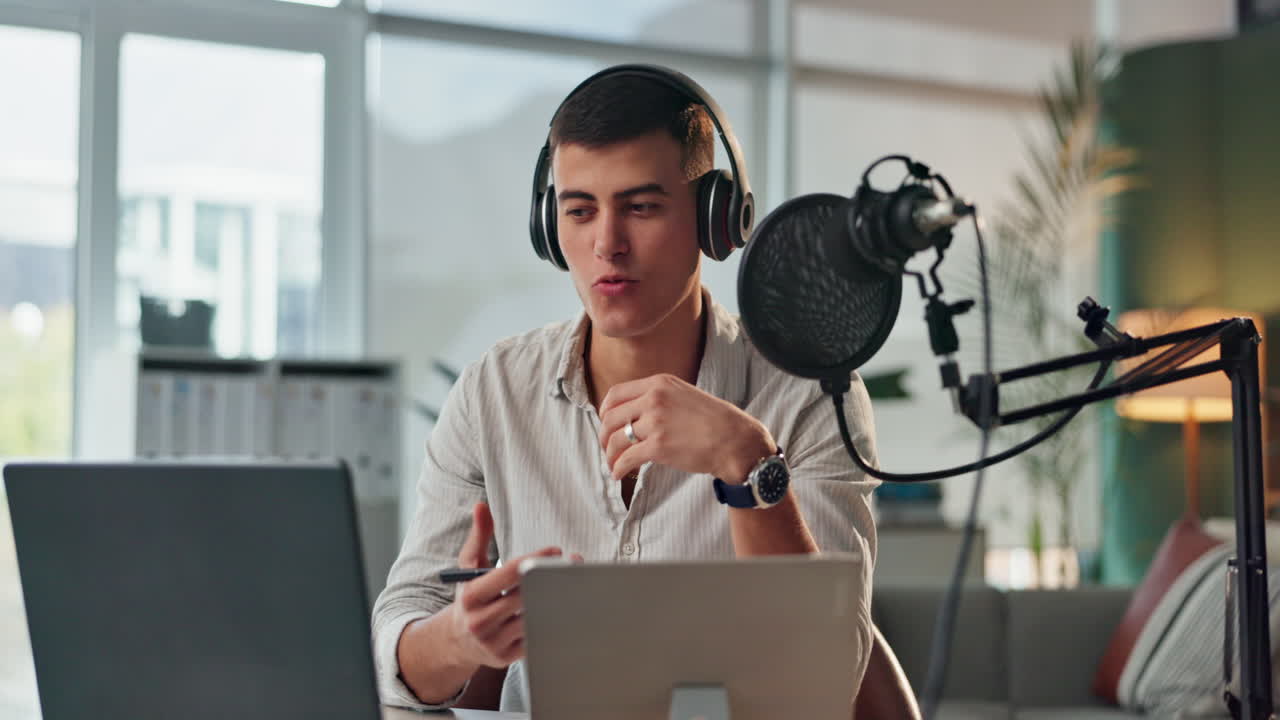 Man recording a podcast at his desk