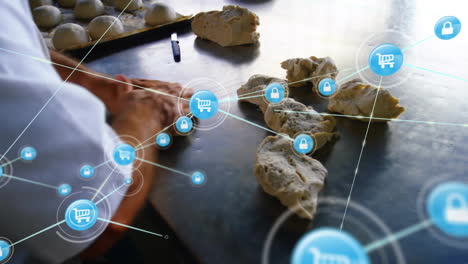 animation of network of connections over caucasian male baker rolling dough