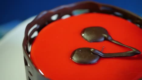 close-up of a red velvet cake with chocolate decorations