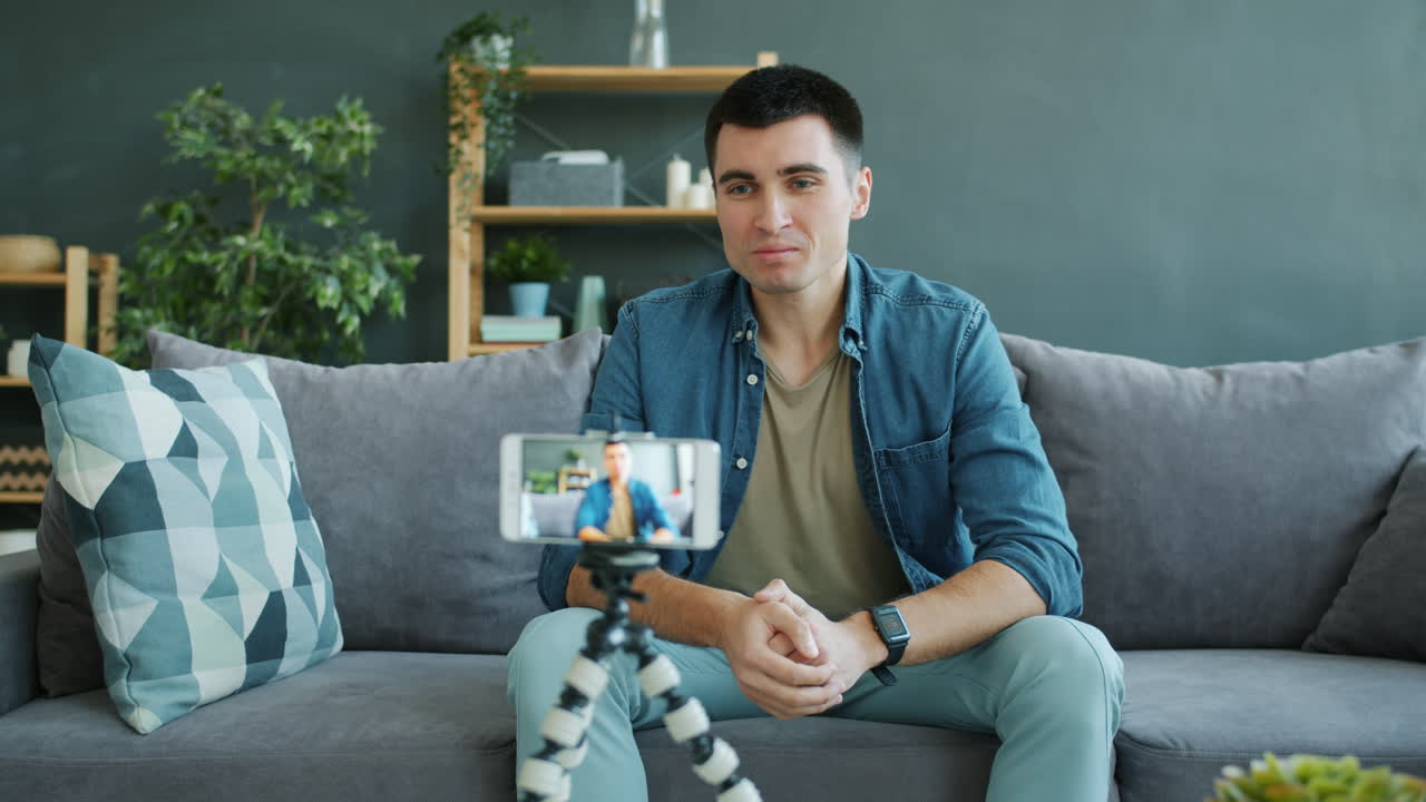 Man giving a video call from home