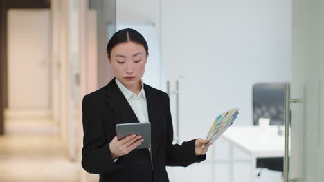 businesswoman reviewing color swatches in modern office