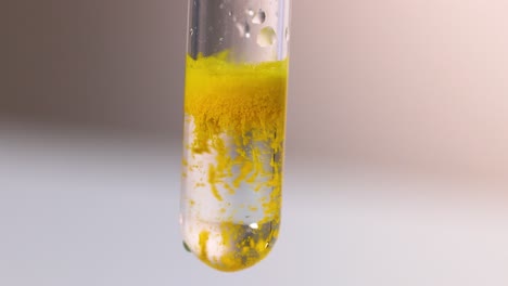 yellow precipitate forms in clear solution