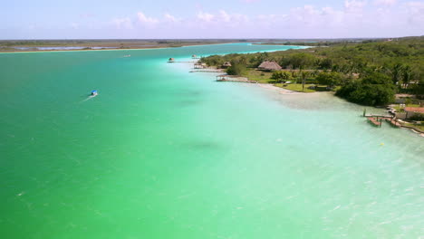 drone shot over turquoise color waters at bacalar mexico