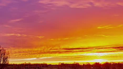 the brightly lit sky changes colors in a glorious sunrise time lapse