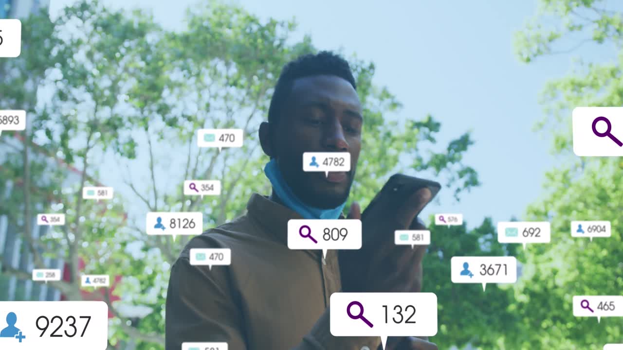 animación de iconos de redes sociales sobre hombre afroamericano hablando en teléfono inteligente al aire libre