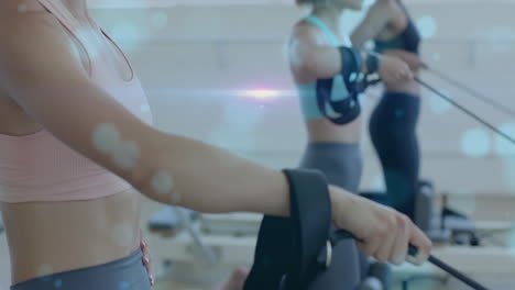 exercising with resistance bands, women doing fitness training in gym background