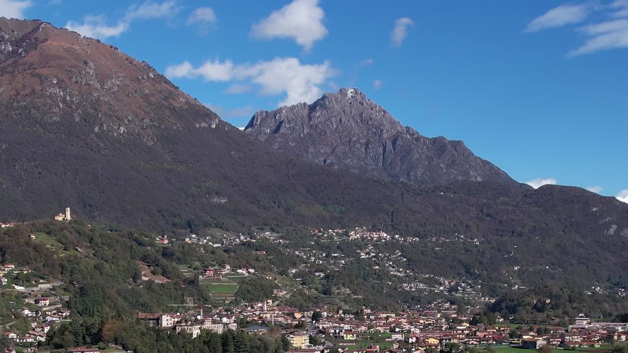 Drone view of the Italian Alps with mountain landscapes and villages