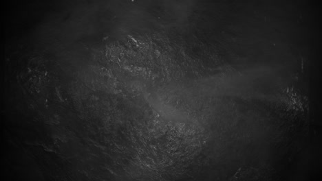 fly particles and smoke on black grunge texture