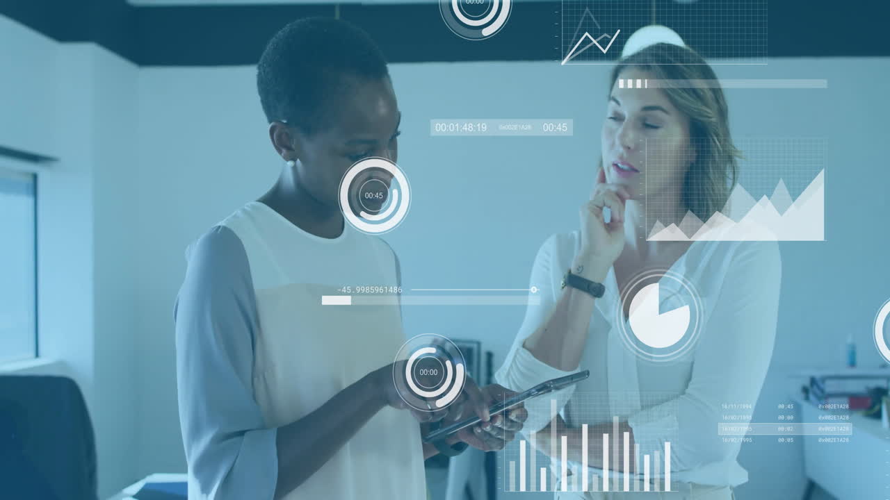Animation of data processing and diagrams over diverse female colleagues discussing work